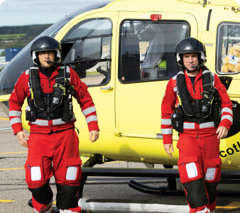 Scotland Charity Air Ambulance team members returning from a rescue